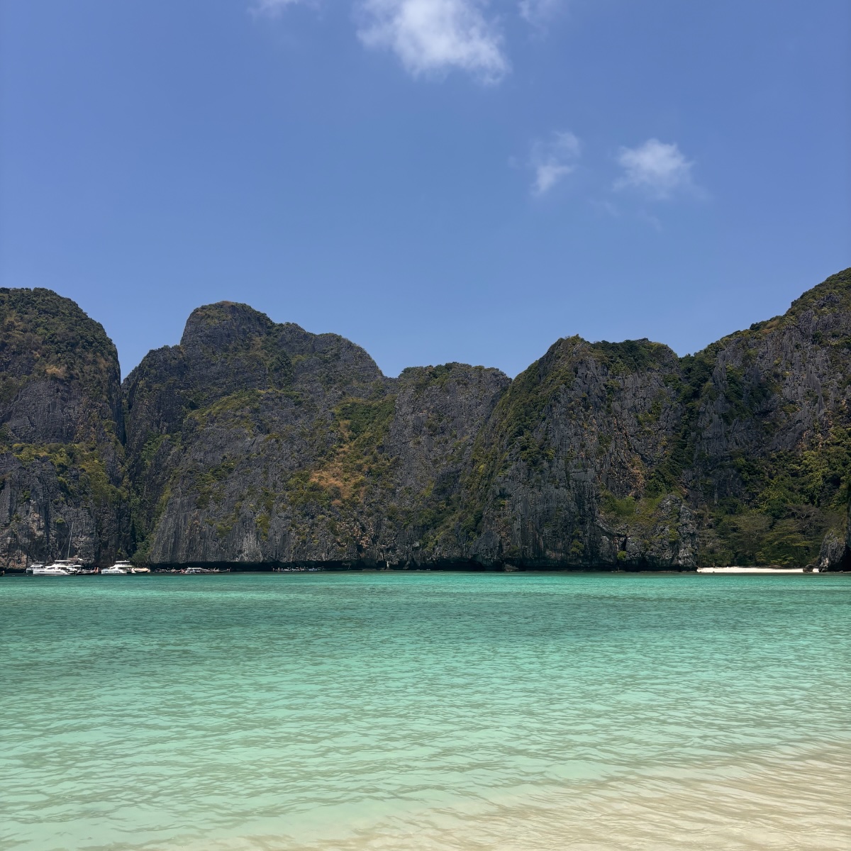 Turquoise bay ringed by limestone cliffs